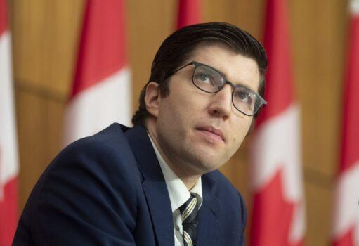 Conservative MP Garnett Genuis watches a speaker present during a news conference in Ottawa, Canada, on Nov. 26, 2020. (Adrian Wyld/The Canadian Press)