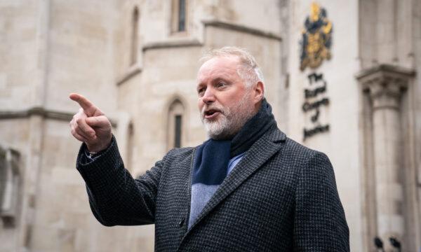 Former police officer Harry Miller speaks to the media outside the Royal Courts of Justice in London on Dec. 20, 2021. (Dominic Lipinski/PA)