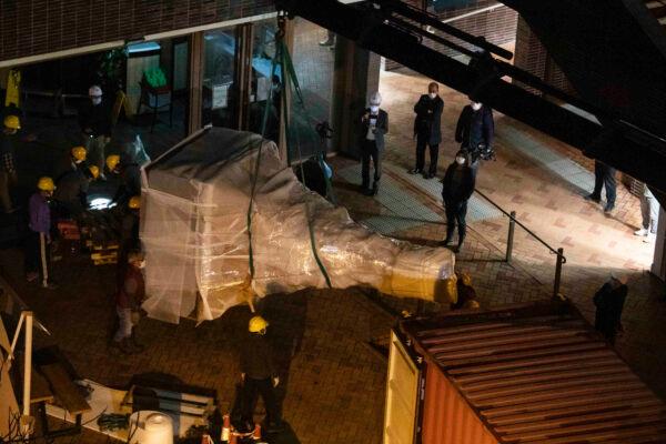 The "Pillar of Shame" statue, a memorial for those killed in the 1989 Tiananmen massacre, is removed from the University of Hong Kong, on Dec. 23, 2021. (Lam Chun Tung/The Initium Media via AP)