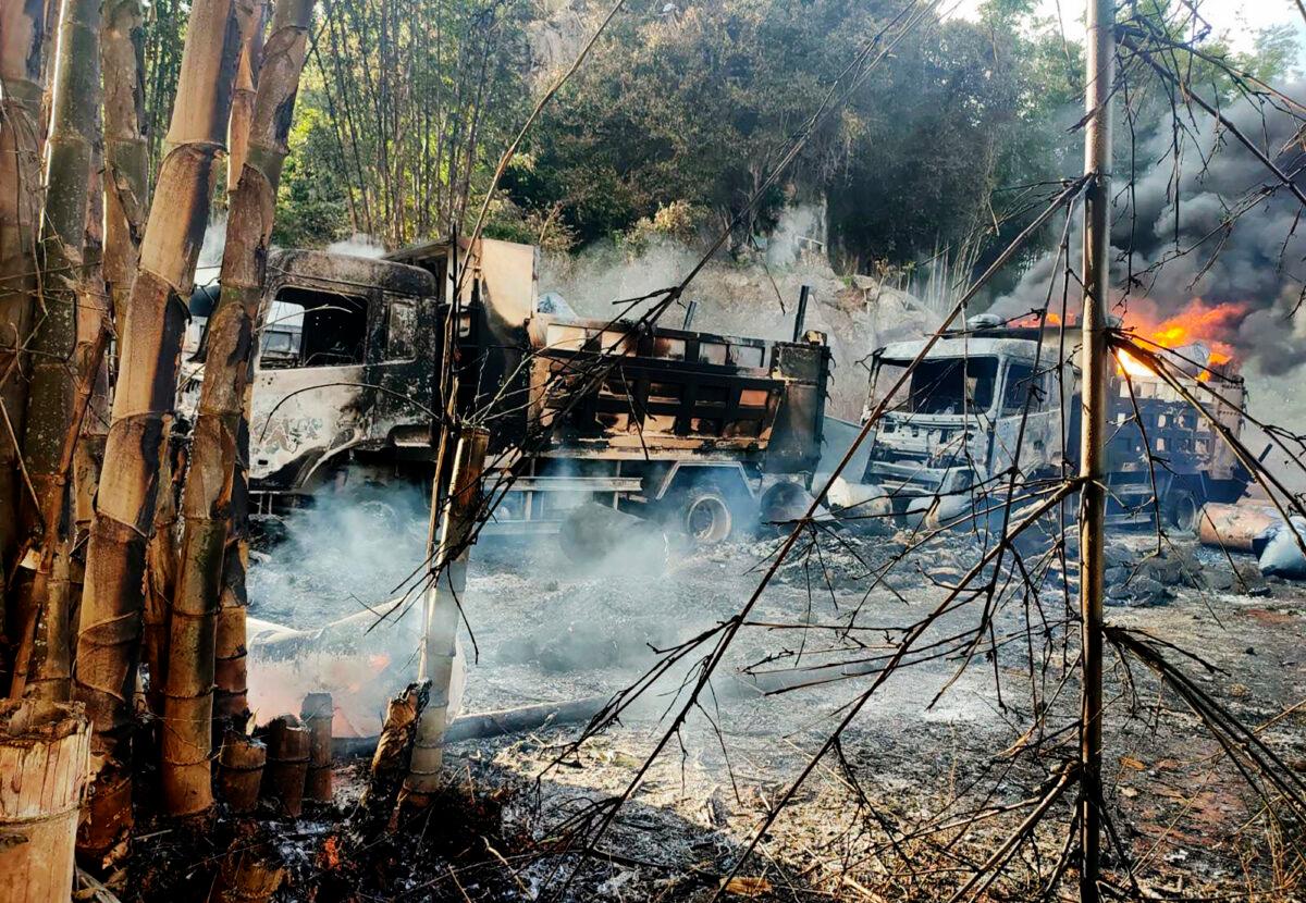 Smoke and flames billow from vehicles in Hpruso township, Kayah State, Myanmar, on Dec. 24, 2021. (Karenni Nationalities Defense Force/ via AP)