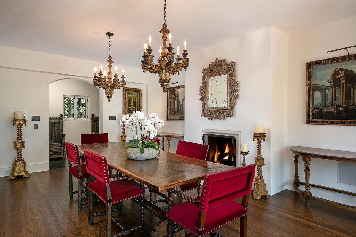 The dining room at Siena Way is yet another classic from the time, a warm and inviting space with just the right luxurious accents. This room exudes a quiet reminder of the Tudor Revivalist movement popular in this era. (Courtesy of Jim Bartsch/Jade Mills)