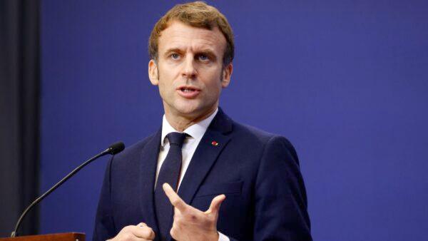 French President Emmanuel Macron gestures as he speaks during a joint press conference with the Hungarian Prime Minister in Budapest on Dec. 13, 2021. (Ludovic Marin/AFP via Getty Images)