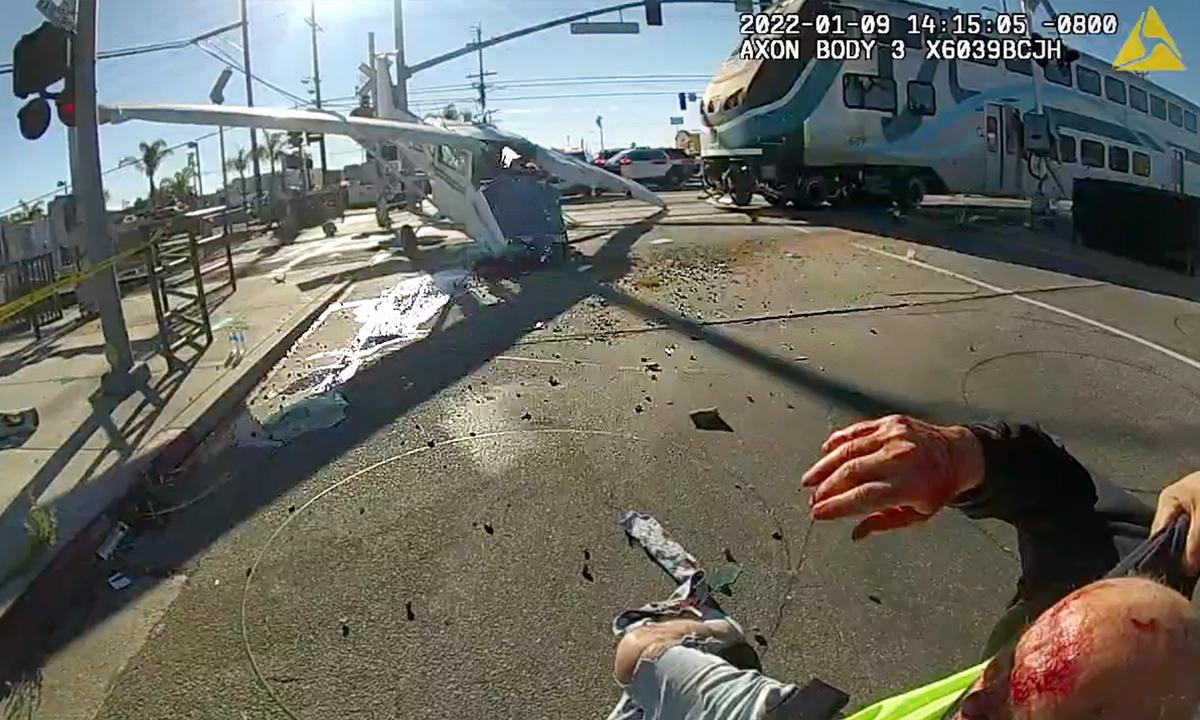 Bodycam Shows LAPD Officers Freeing Pilot Trapped in Plane Crashed on Railway Moments Before Train Hits