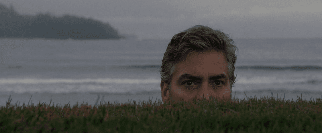 Matt King (George Clooney) spying on Brian Speer, his wife's lover, in “The Descendants." (FOX Searchlight Pictures)