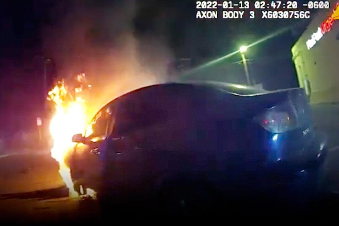 Heart-Pounding Bodycam Footage Shows Police Officer Selflessly Pull Unconscious Woman From Burning Car