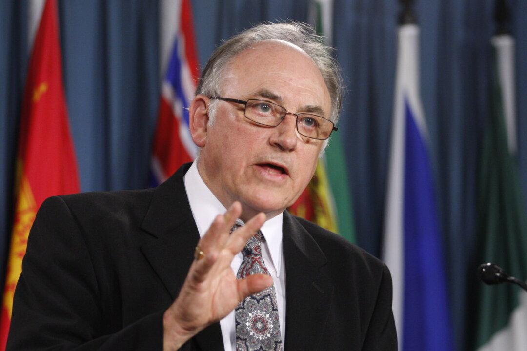 Charter’s Last Surviving Signatory and Former Premier Sues Ottawa Over Travel Vaccine Mandates