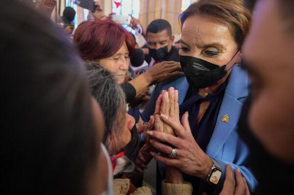 Honduran president-elect Xiomara Castro greets a believer during a mass on the 275th apparition of the Suyapa Virgin, Honduras' patron saint, at the Suyapa Basilica in Tegucigalpa on Feb. 3, 2022. (Orlando Sierra/AFP)