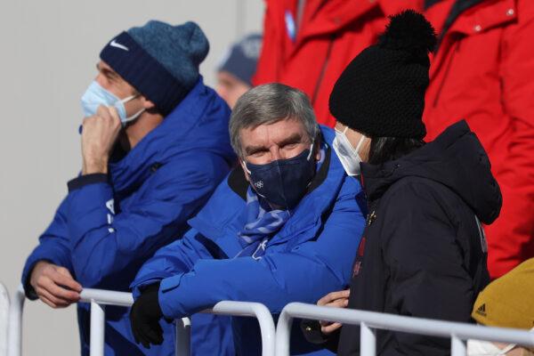 Thomas Bach, IOC president speaks with Peng Shuai prior to the Women's Freestyle Skiing on Day 4 of the Beijing 2022 Winter Olympic Games at Big Air Shougang on Feb. 8, 2022. (Richard Heathcote/Getty Images)