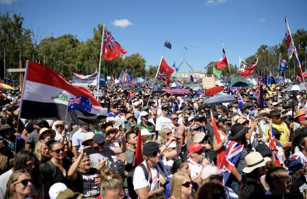 Protesters against vaccine mandates gather on the lawn of Parliament House in Canberra, Australia, on Feb. 12, 2022. (Tracey Nearmy/Getty Images)