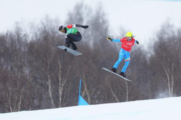 Lindsey Jacobellis of Team United States (L) and Michela Moioli of Team Italy compete during the snowboard mixed team cross big final on Day 8 of the Beijing 2022 Winter Olympics at Genting Snow Park, in Zhangjiakou, China, on Feb. 12, 2022. (Lars Baron/Getty Images)