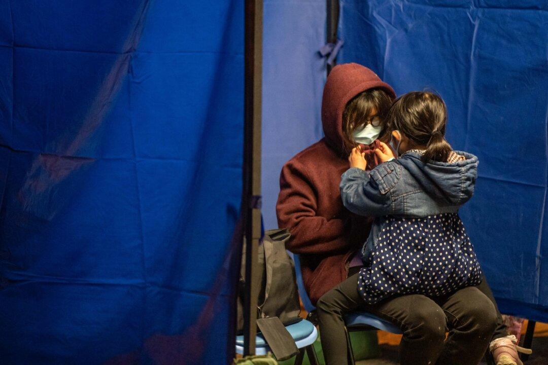 Hong Kong Hospitals Struggle as Virus Cases Surge