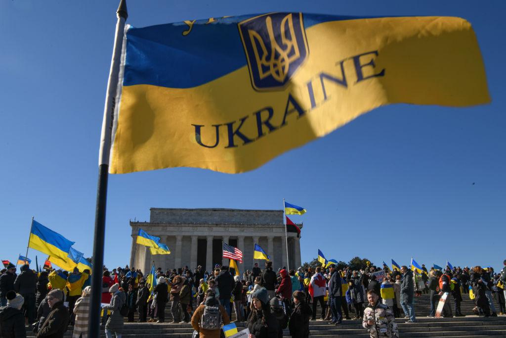 Demonstrators gather at the Lincoln Memorial to stand in solidarity with Ukraine and protest against the rising tensions between Russia and Ukraine before marching to the White House in Washington on Feb. 20, 2022. Attendees called for President Joe Biden to take a stronger stance on deterring Russia from invading Ukraine and demanded the end of Russia's occupation of Crimea. (Kenny Holston/Getty Images)