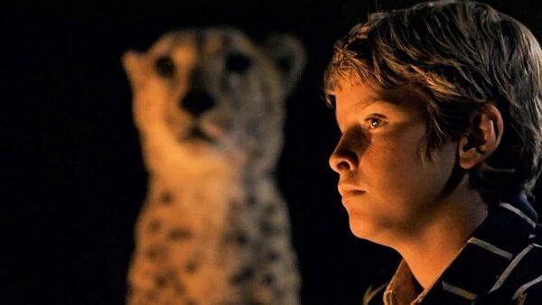 Alexander Michaletos as Xan and the cheetah in "Duma." (Warner Bros.)