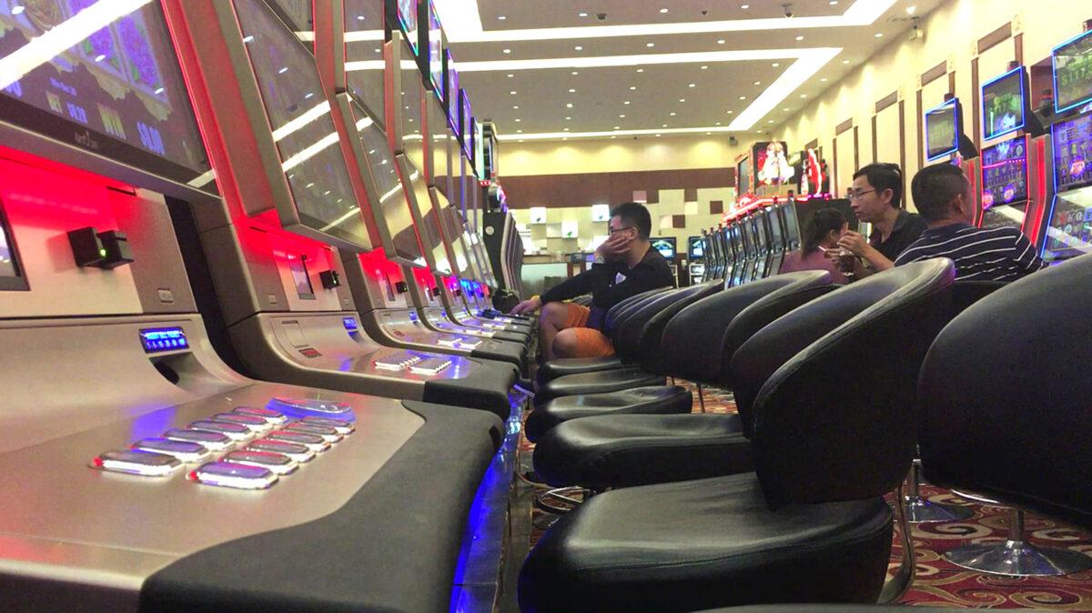 Chinese customers playing on slot machines inside a Chinese-run casino in Sihanoukville, the coastal capital of Preah Sihanouk province in Cambodia, on Dec. 13, 2018. (Sophie Deviller/AFP via Getty Images)
