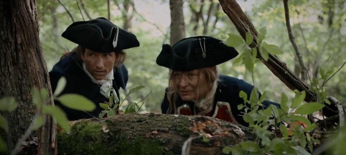 George Washington (Willie Mellina, L) prepares one of hsi men for battle in “Washington’s Armor.” (Tammy Lane Productions)