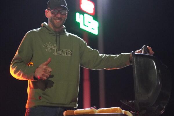 Dave Wakefield was handing out free hotdogs and free bibles in Lore City, Ohio, on March 3, 2022. (Enrico Trigoso/The Epoch Times)