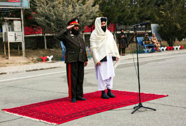 Taliban acting Interior Minister Sirajuddin Haqqani (R) reviews new Afghan police recruits during a graduation ceremony at the police academy in Kabul, Afghanistan, on March 5, 2022. (AP Photo)