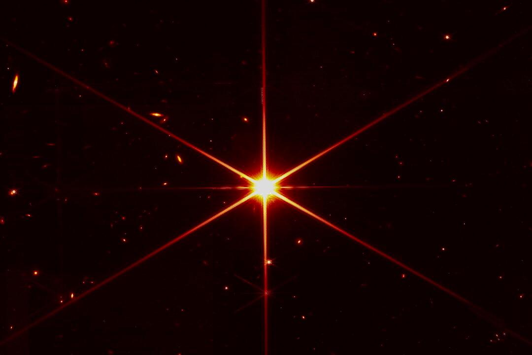 Space Telescope’s Image of Star Gets Photobombed by Galaxies