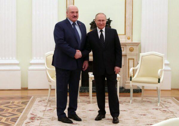 Russian President Vladimir Putin (R) meets with Belarus President Alexander Lukashenko at the Kremlin in Moscow, on March 11, 2022. (Mikhail Mikhail Klimentyev/Sputnik/AFP via Getty Images)