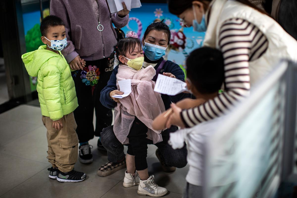 Children prepare to receive a vaccine against COVID-19 at a vaccination site in Wuhan, Hubei Province, China, on Nov. 18, 2021. (Getty Images)