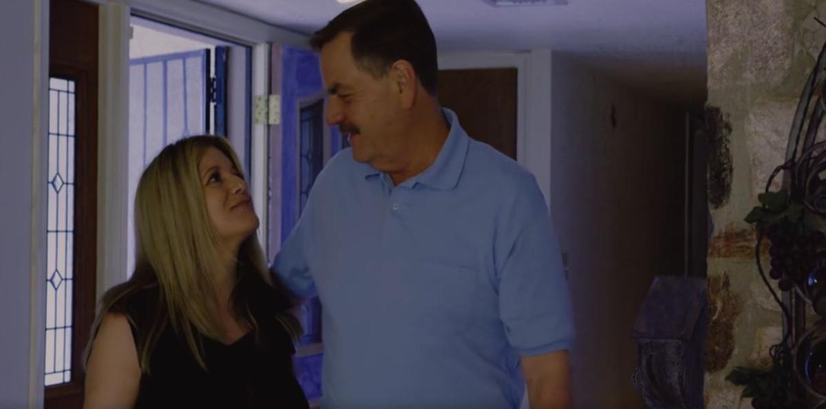 Bruce (Keith Lopez, R) and his wife Laura (Tina Marie Nigro) in “Anti Coronavirus.” (Applied Art Productions)