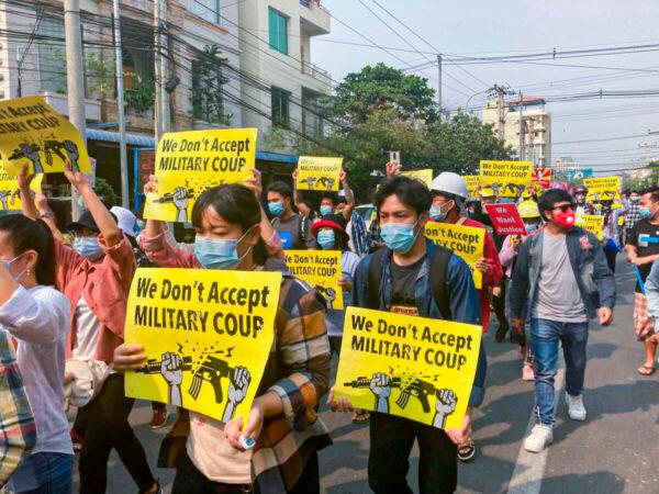 Anti-coup protesters during a march in Mandalay, Burma, on March 14, 2021. (AP Photo)