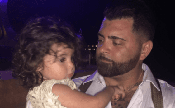 Screenshot from GiveSendGo account showing Roberto Minuta holding his daughter. (With permission from Gissela Minuta.)