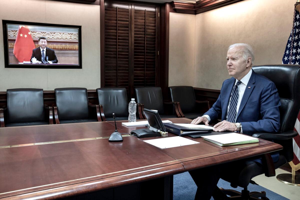 President Joe Biden meets virtually from the Situation Room at the White House with Chinese leader Xi Jinping, on March 18, 2022. (The White House via AP)
