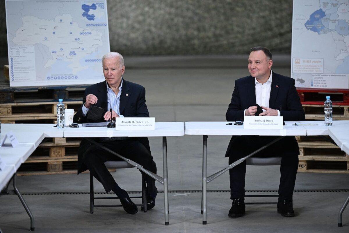 U.S. President Joe Biden and Polish President Andrzej Duda receive an overview of the Combined Operations Integration Cell in Rzeszow, Poland, on March 25, 2022. (Brendan Smialowski/AFP via Getty Images)