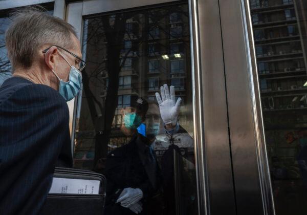 Australian Ambassador to China Graham Fletcher (L) is not allowed entry by court officials and police as he tries to enter the trial of Chinese Australian journalist Cheng Lei at the Beijing Number 2 Intermediate People's Court in Beijing on March 31, 2022. (Kevin Frayer/Getty Images)