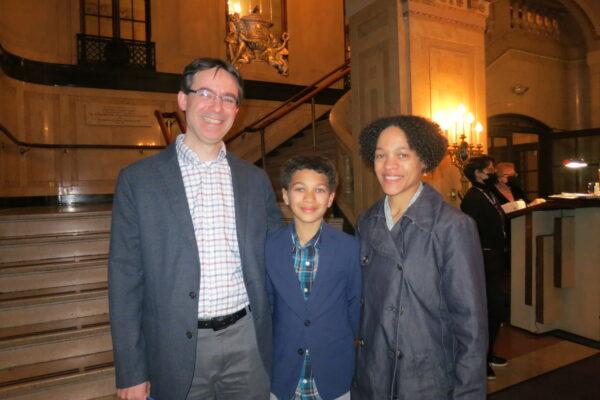 Adam and Jennifer Desrosiers with their son at the Shen Yun performance in Boston, on April 2, 2022. (Sally Sun/The Epoch Times)
