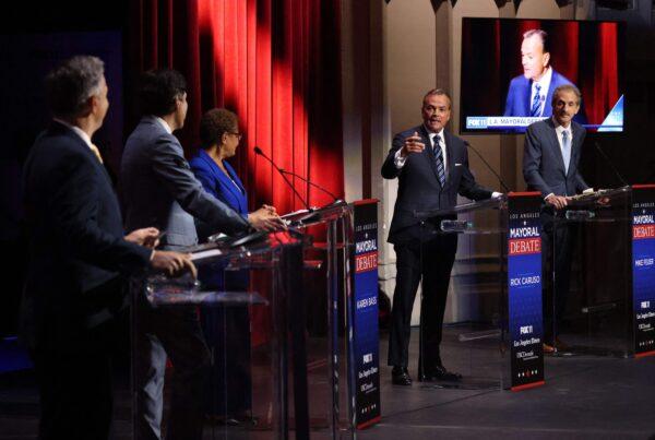 Rick Caruso (2nd R) makes a rebuttal during the mayoral debate with candidates (from L) Joe Buscaino, Kevin de Leon, Karen Bass and Mike Feuer at USC's Bovard Auditorium in Los Angeles on March 22, 2022. (Myung J. Chun/Pool/AFP via Getty Images)