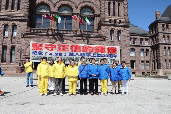 Falun Gong practitioners who participated in the appeal in Beijing on April 25, 1999, pose at the Ontario legislature on April 14, 2022, during a rally to commemorate the 23rd anniversary of the incident. (Michelle Hu/The Epoch Times)