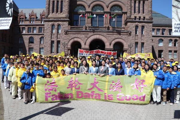 Toronto Falun Gong practitioners gather at the Legislative Assembly of Ontario to commemorate the 23rd anniversary of the appeal to release arrested practitioners in China, on April 14, 2022. (Michelle Hu/The Epoch Times)