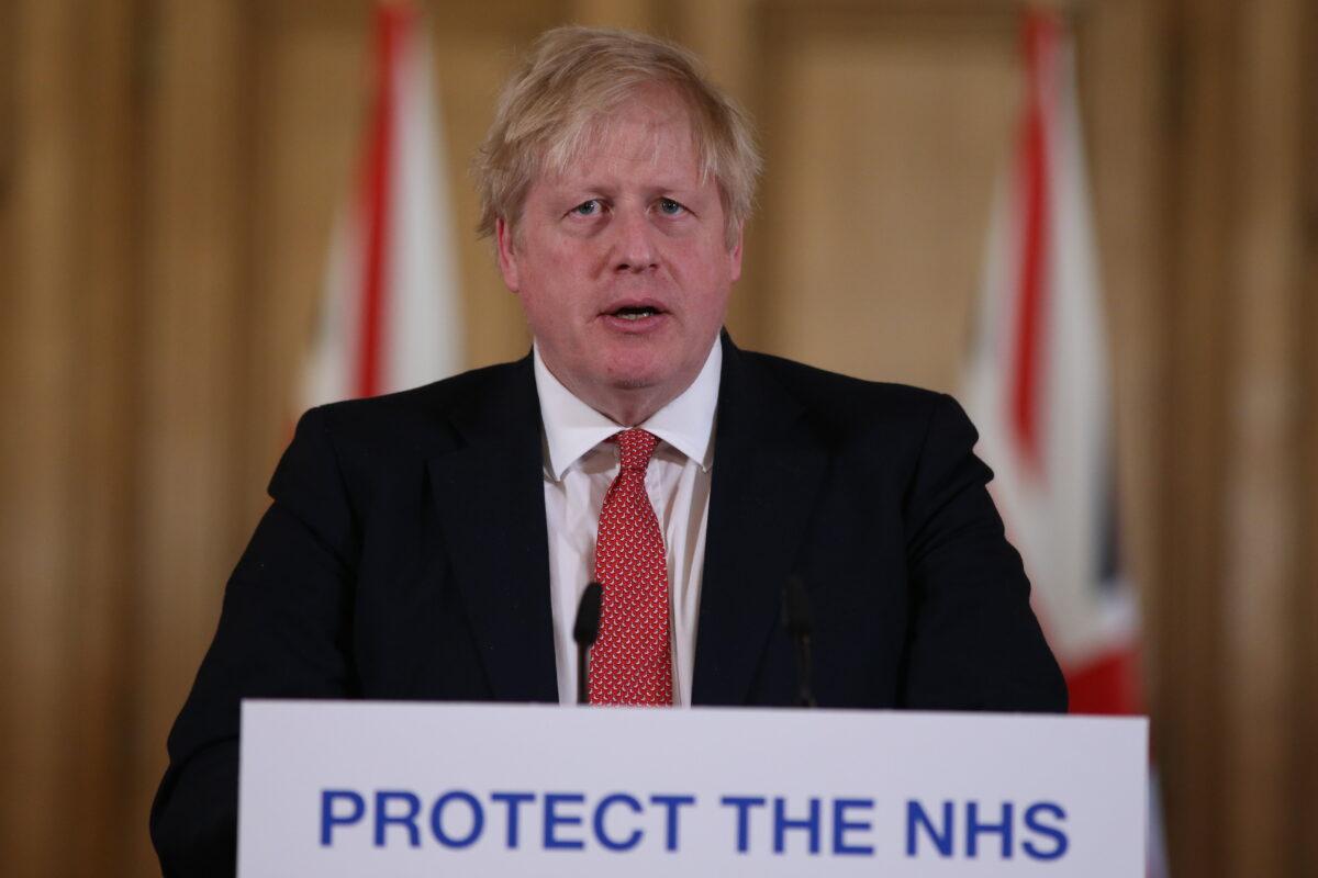British Prime Minister Boris Johnson gives his daily COVID-19 press briefing at Downing Street in London on March 22, 2020. (Ian Vogler/WPA Pool/Getty Images)