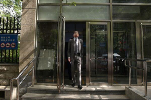 Australian Ambassador to China Graham Fletcher walks out from an entrance to the Beijing Second Intermediate People's Court after being refused access to the trial of Australian academic Yang Jun, also known as Yang Hengjun, on espionage charges in Beijing, China, on May 27, 2021. (Nicolas Asfouri/AFP via Getty Images)