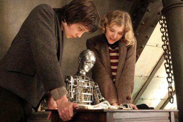 The automaton surrounded by Hugo (Asa Butterfield) and Isabelle (Chloe Grace Moretz). (Paramount Pictures)