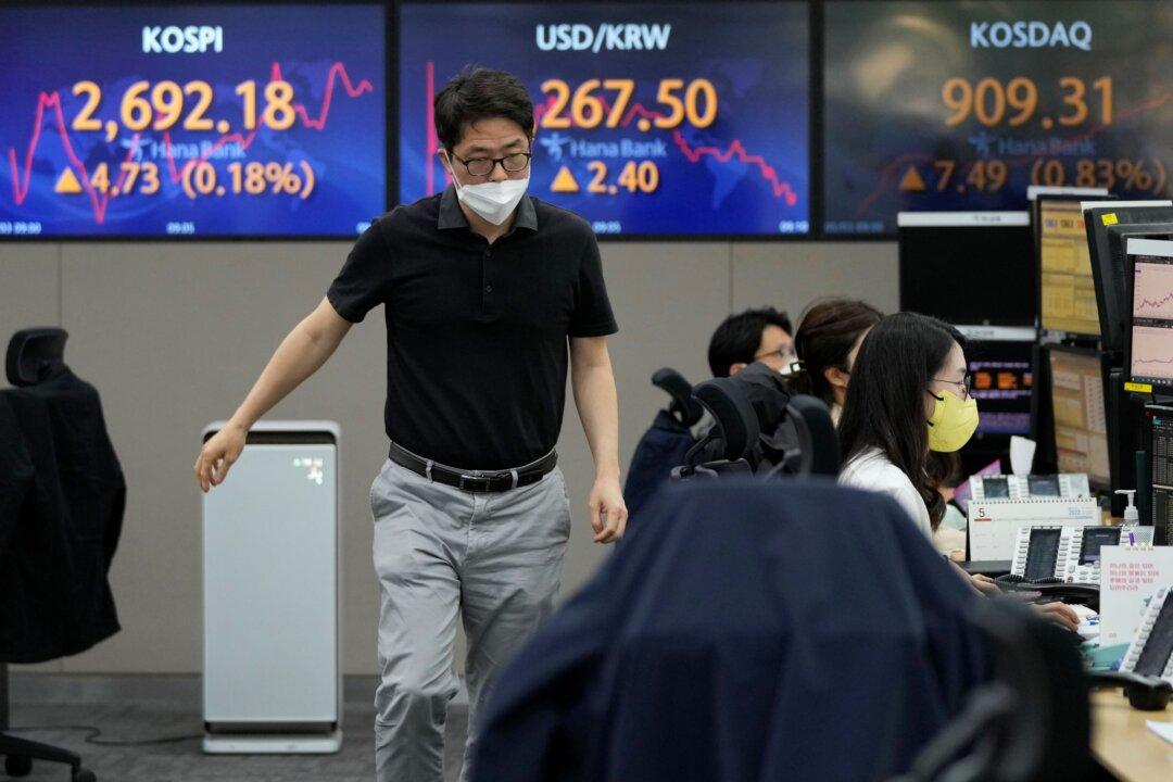 Asian Shares Mixed as Australia Hikes Interest Rate