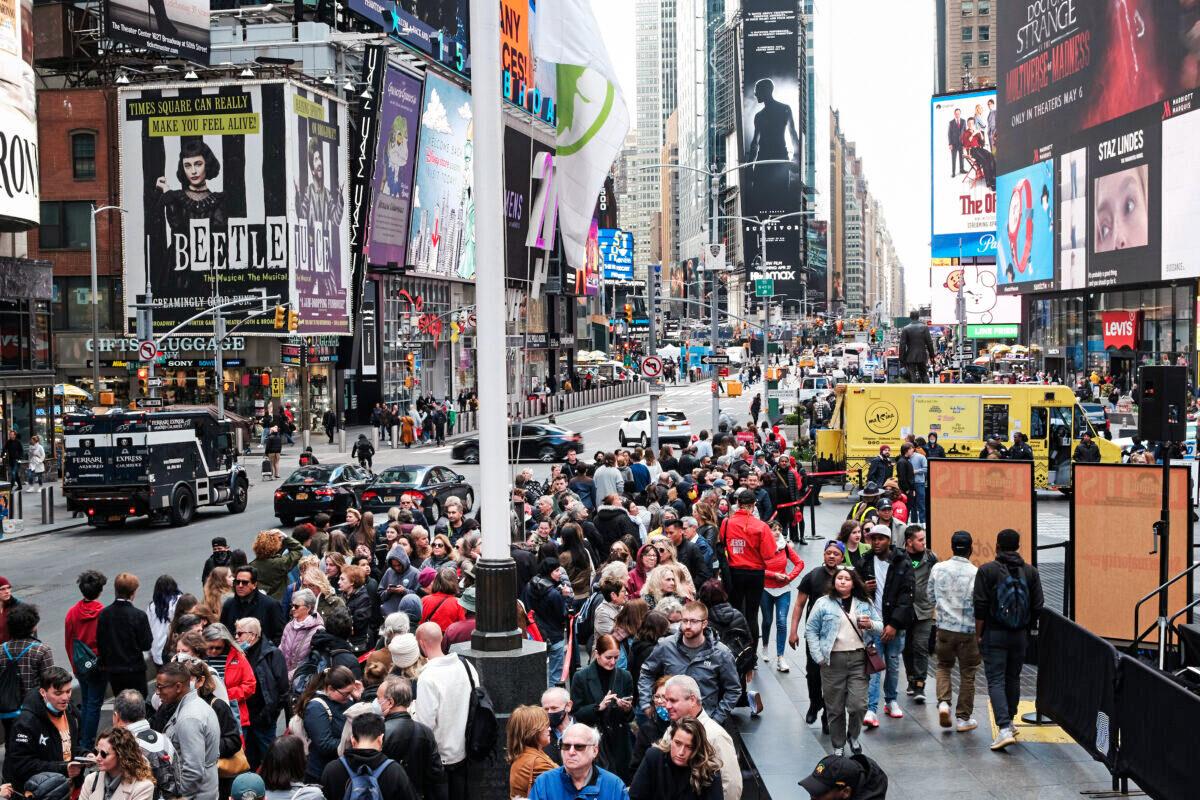 People wait in line to buy theater tickets in Times Square in New York City, on April 27, 2022. (Spencer Platt/Getty Images)