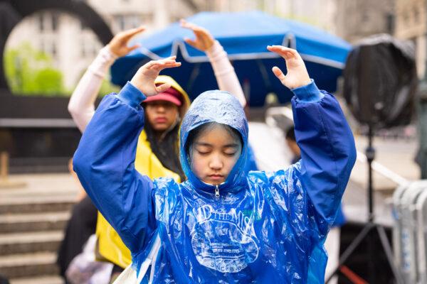 Falun Gong practitioners take part in an event to celebrate World Falun Dafa Day in Foley Square in New York City on May 7, 2022. (Larry Dye/The Epoch Times)