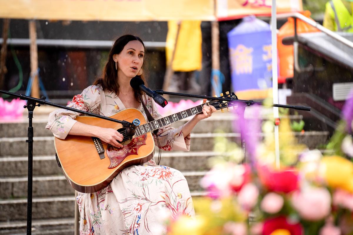 Katy Mantyk takes part in an event to celebrate World Falun Dafa Day in Foley Square in New York City on May 7, 2022. (Samira Bouaou/The Epoch Times)