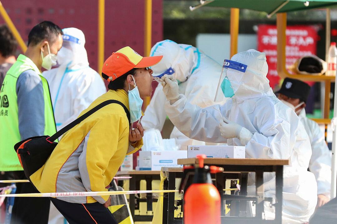 Beijing Ratchets Up COVID-19 Curbs, Sparking Fears of Citywide Lockdown