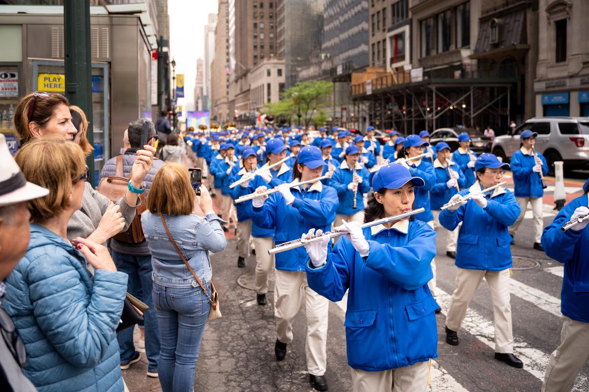 Falun Gong practitioners take part in a parade marking the 30th anniversary of its introduction to the public, in Manhattan, New York, on May 13, 2022. (Samira Bouaou/The Epoch Times)