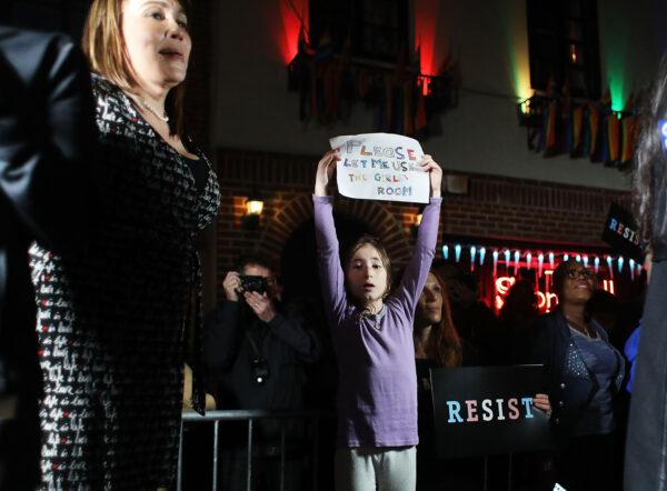 Activists and members of the transgender community protest against a Trump administration announcement that rescinds an Obama-era order allowing transgender students to use school bathrooms matching their gender identities, at the Stonewall Inn on Feb. 23, 2017 in New York. (Spencer Platt/Getty Images)