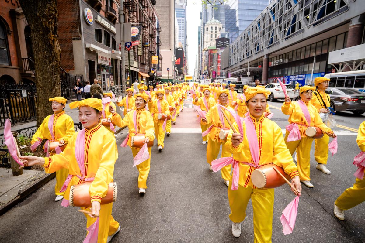 Falun Gong practitioners take part in a parade marking the 30th anniversary of its introduction to the public, in Manhattan, New York, on May 13, 2022. (Samira Bouaou/The Epoch Times)