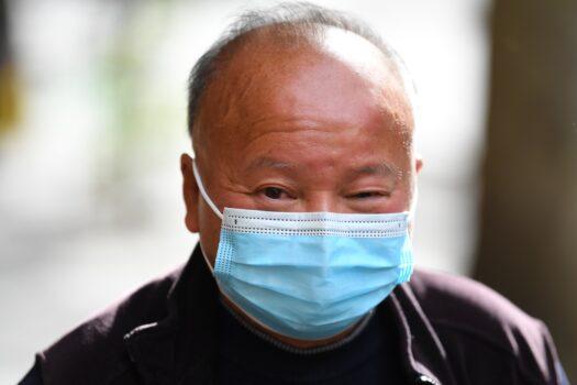 Duong Di Sanh departs from the Melbourne Magistrates' Court in Melbourne, Australia, on May 17, 2022. Former Liberal Party candidate Di Sanh Duong is charged with preparing an act of foreign interference within Australia following a year-long investigation by ASIO and the AFP. (AAP Image/James Ross)