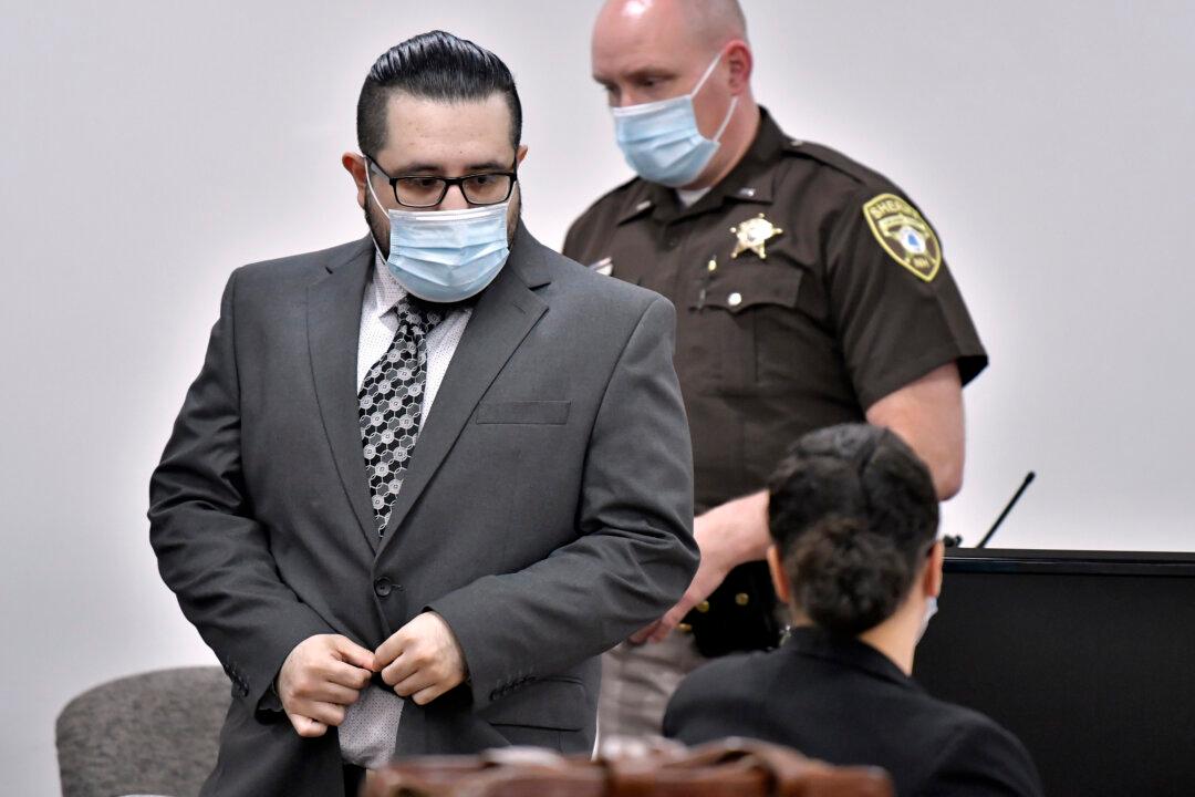 Wife Denies Shooting Co-Worker in Beheading Case