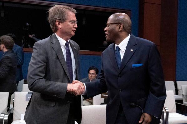 Rep. Tim Burchett (R-Tenn.) (L) shakes hands with Defense Undersecretary for Intelligence and Security Ronald Moultrie, after a hearing on Unidentified Aerial Phenomena in Washington on May 17, 2022. (Jose Luis Magana/AFP via Getty Images)