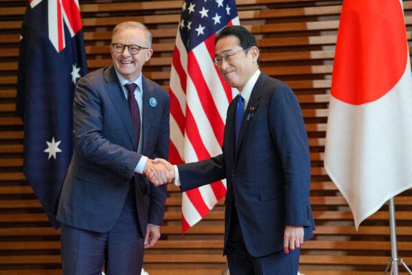 Japanese Prime Minister Fumio Kishida (right) welcomes Australian Prime Minister Anthony Albanese (left) at the premier office in Tokyo, Japan, on May 24, 2022. (ZHANG XIAOYU/POOL/AFP via Getty Images)
