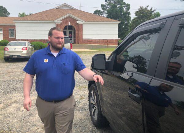 Judge Brandon Rivers heads for his truck after voting at the Arabi Baptist Church in Arabi, Ga., on May 24, 2022. (Nanette Holt/The Epoch Times)